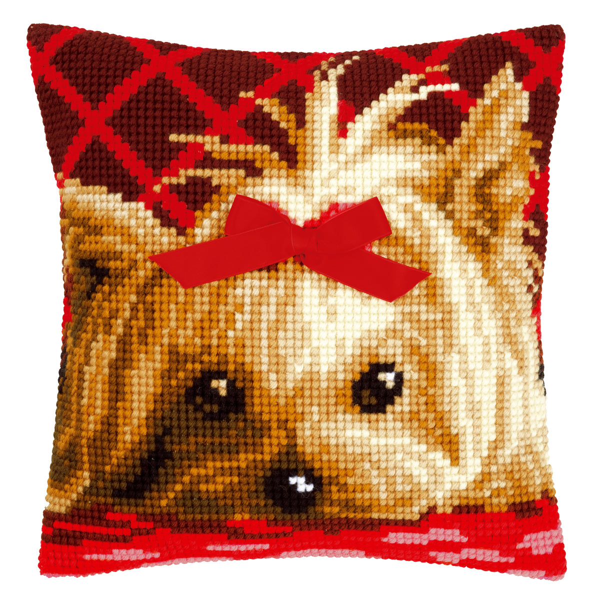 Cross stitch cushion with a Yorkshire terrier wearing a bow