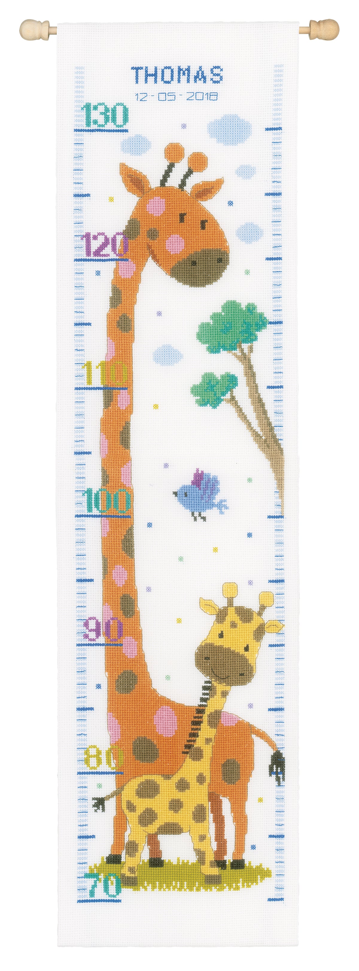 Cross stitched children's height chart with a giraffe