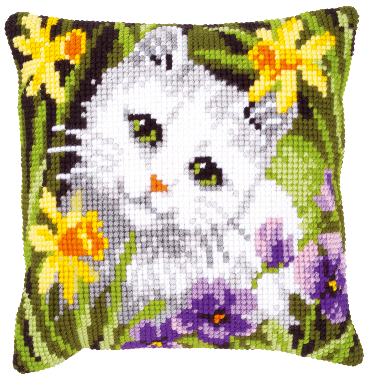 Cross stitch cushion with a white cat among daffodils