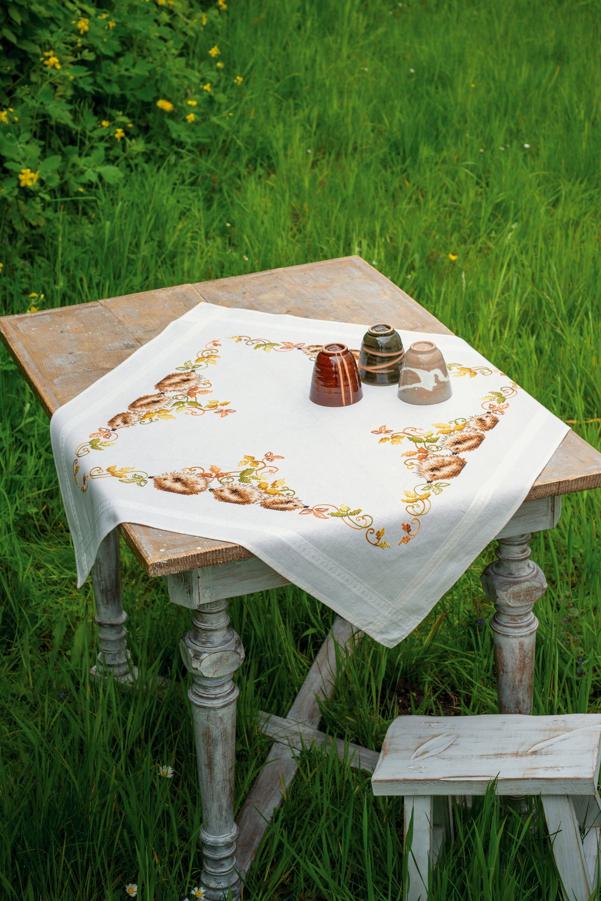 Embroidered tablecloth with hedgehogs and autumn leaves