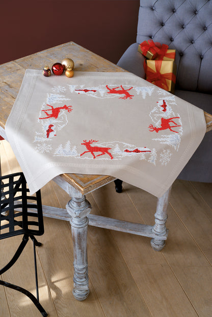 Square beige tablecloth with a Nordic winter cross stitch border design