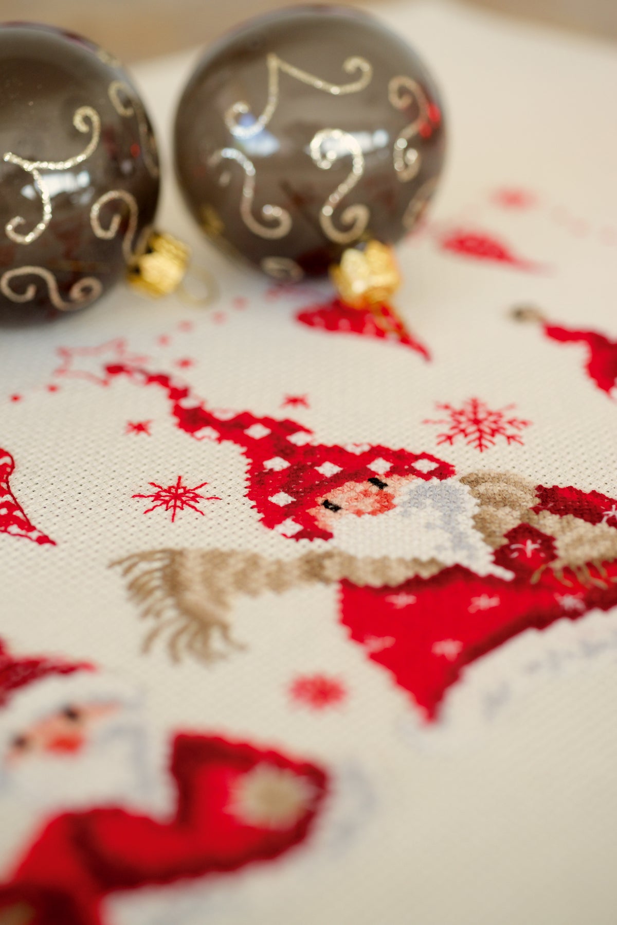 Cross stitch picture of cheerful Father Christmas figures