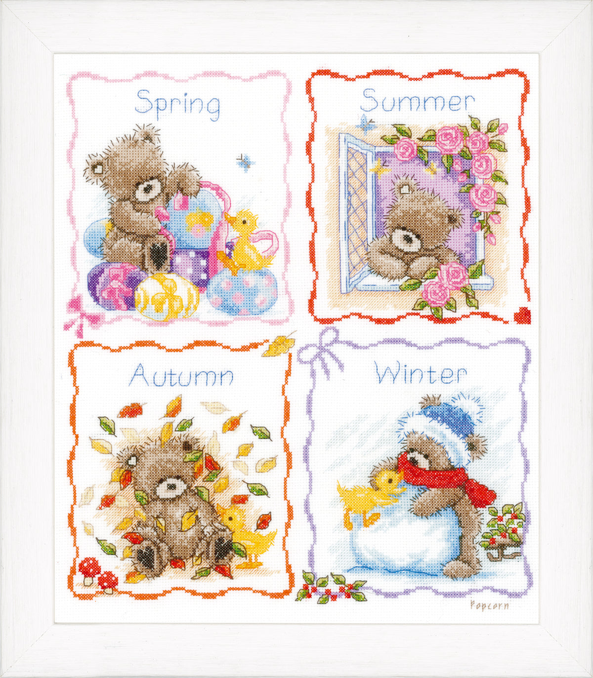 Cross stitch picture of the four seasons with raised French knot details