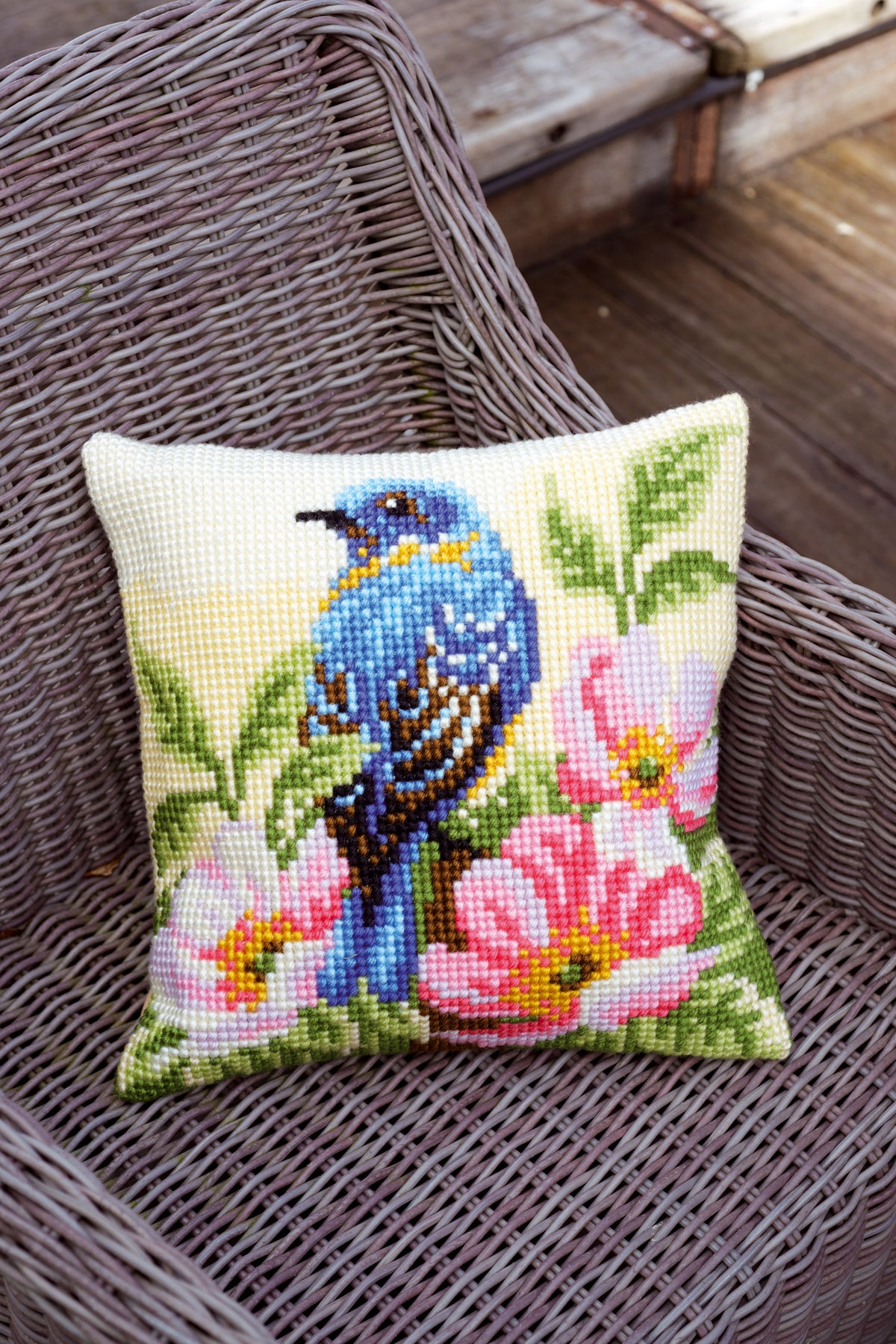 Vervaco cross stitch cushion showing a bird perched on a rose bush