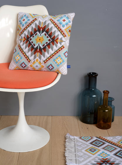 Cross stitch cushion with an ethnic pattern