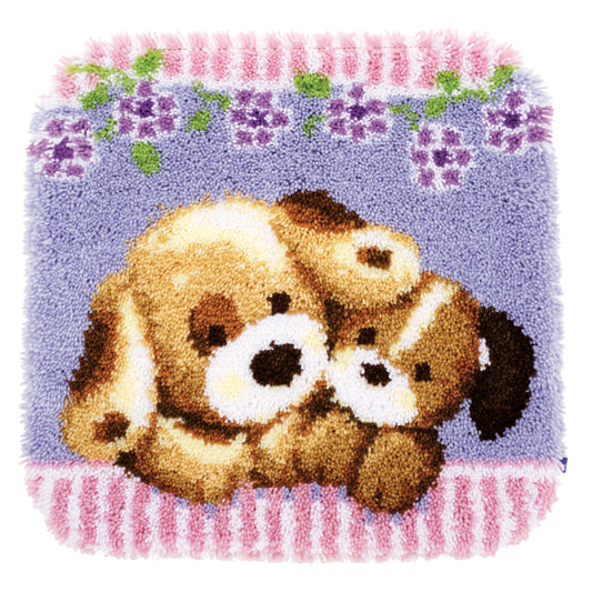 Latch hook rug showing two dogs cuddling