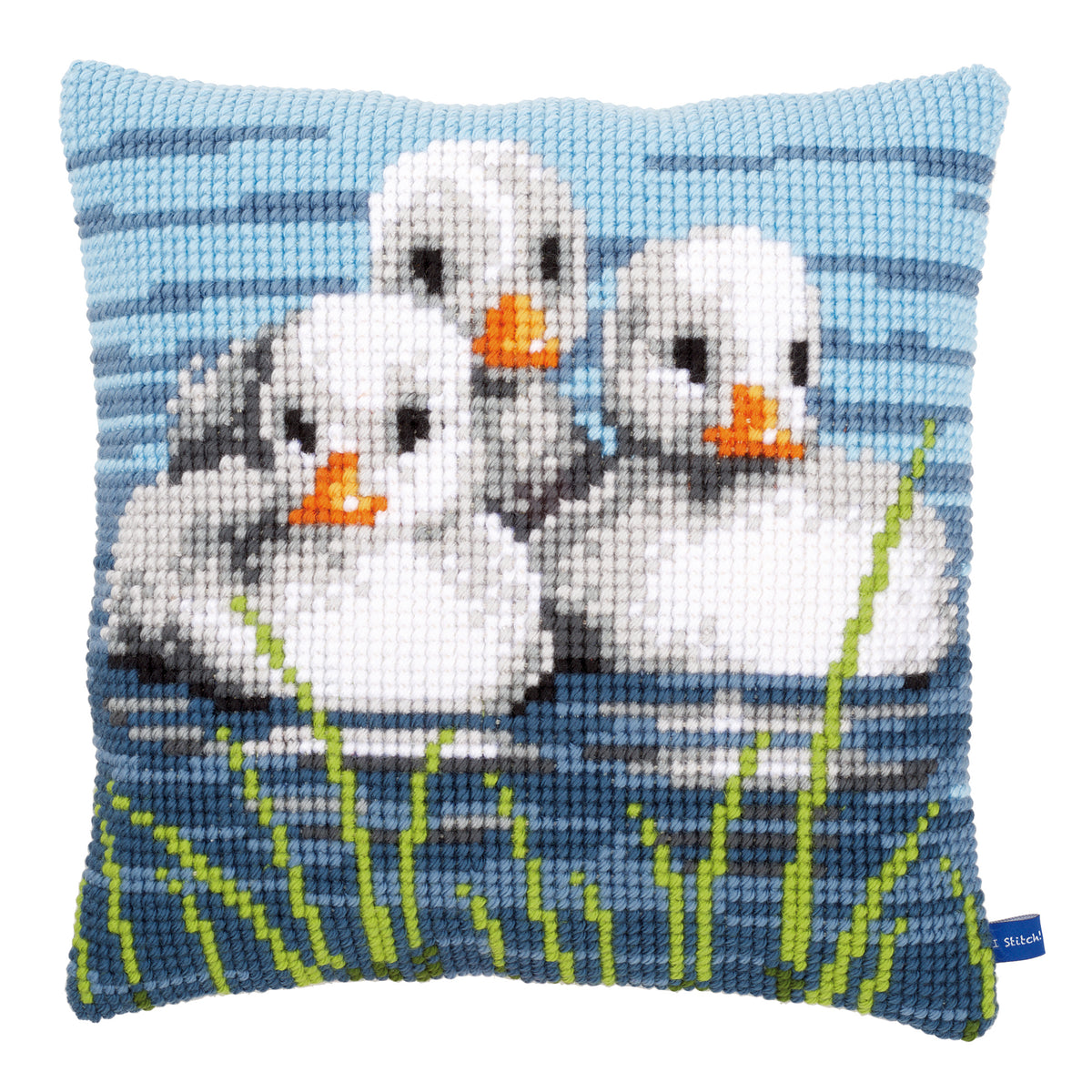 Cross stitch cushion showing ducklings swimming in water