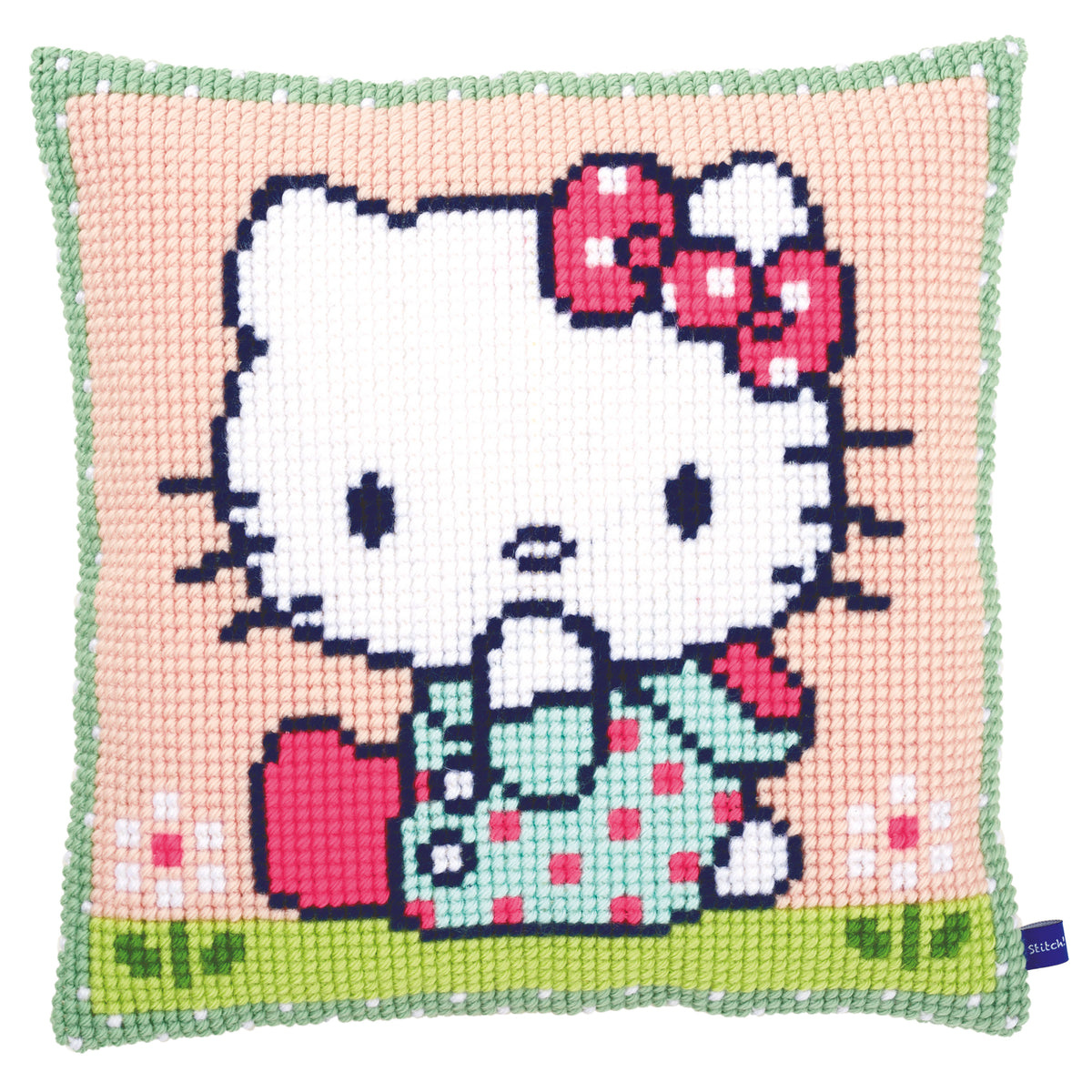 Hello Kitty cross stitch cushion with Kitty on a green lawn
