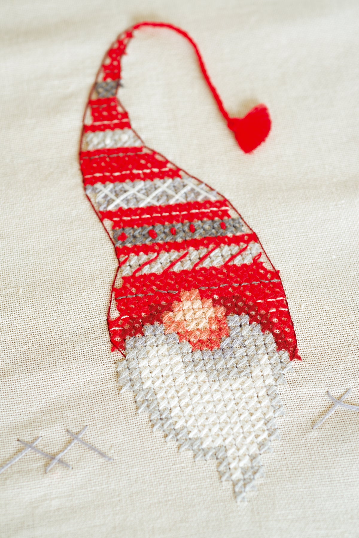 Embroidered ecru tablecloth with Christmas elf designs
