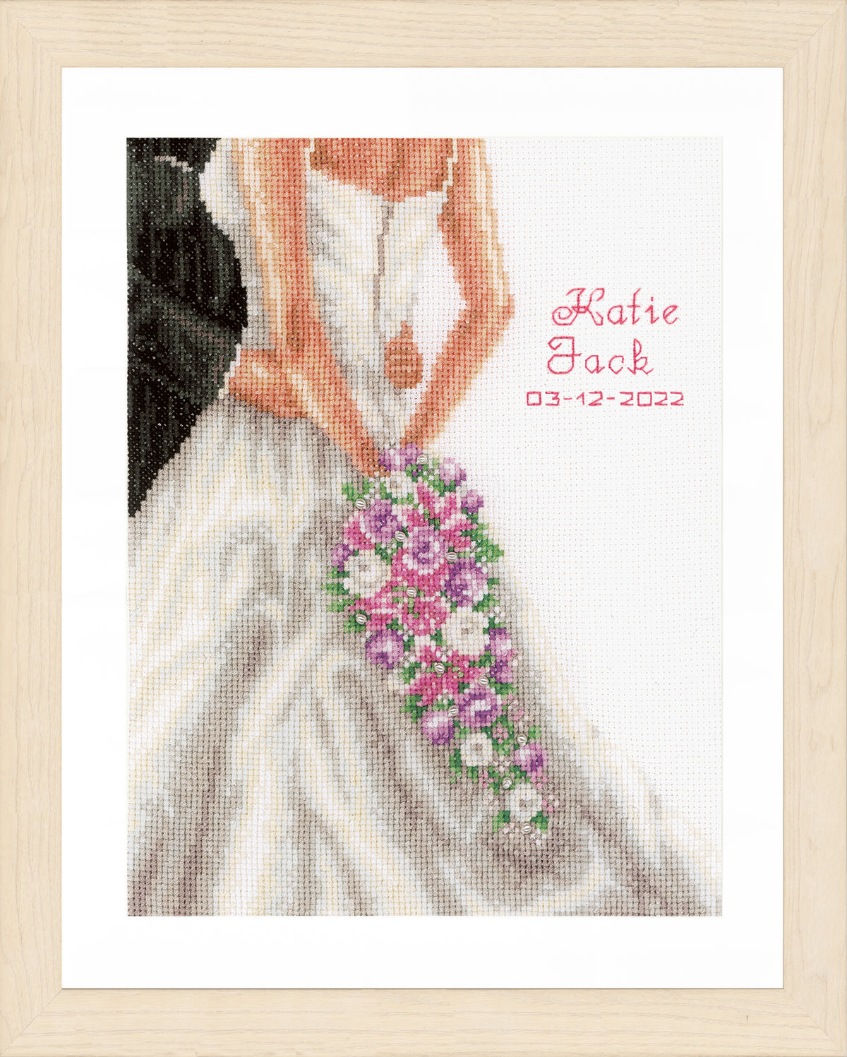 Cross stitch wedding record with bride and groom