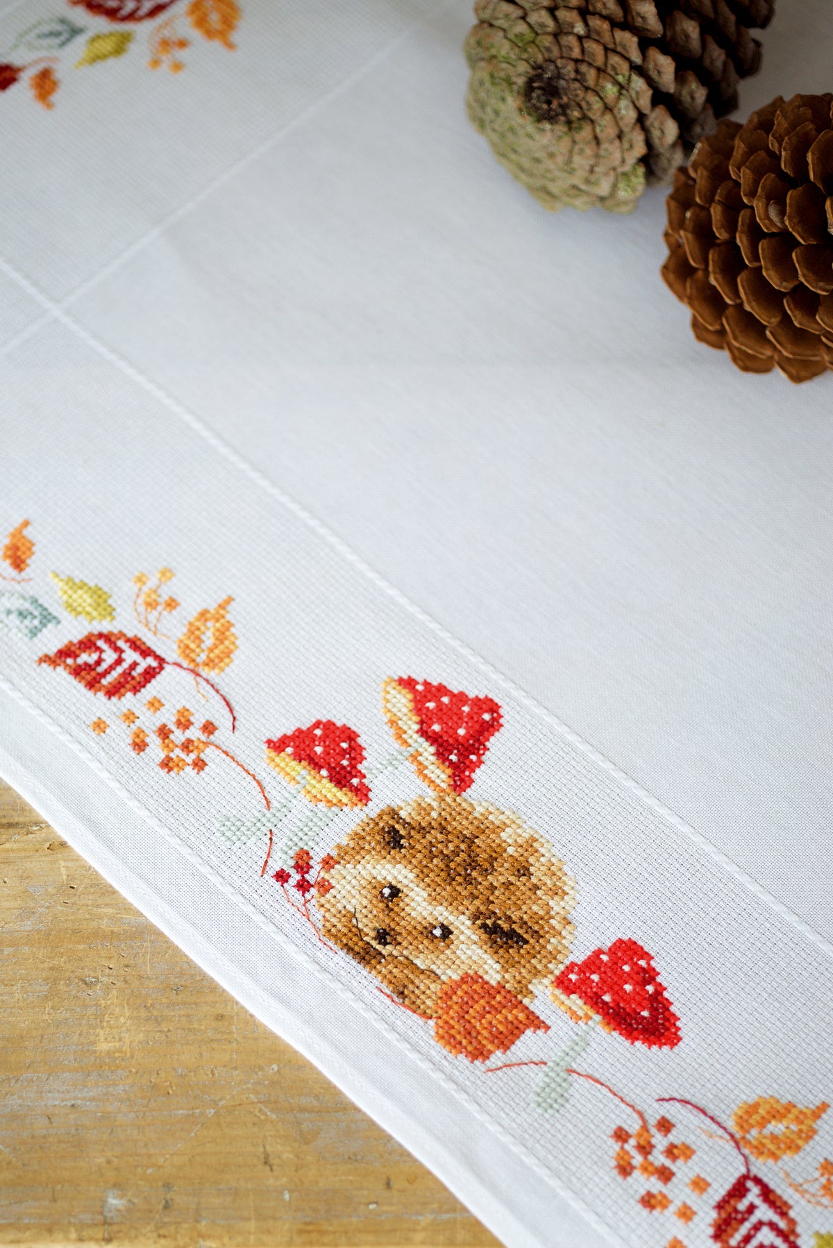 Cross stitch tablecloth with hedgehogs and mushrooms