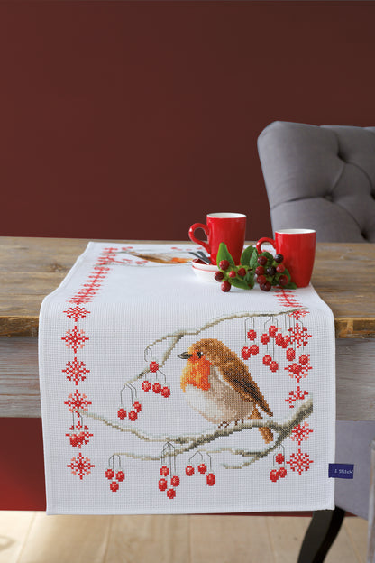 Cross stitch table runner featuring robins on white aida