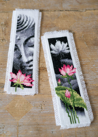 Two cross stitch bookmarks with lotus flower and Buddha designs
