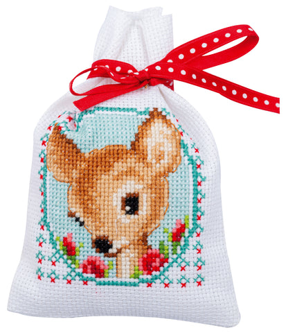 Three cross stitch gift bags with fairy tale designs