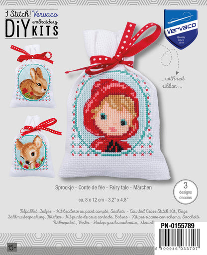 Three cross stitch gift bags with fairy tale designs