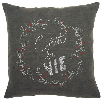 C'est La Vie embroidered cushion kit by Vervaco on dark grey fabric