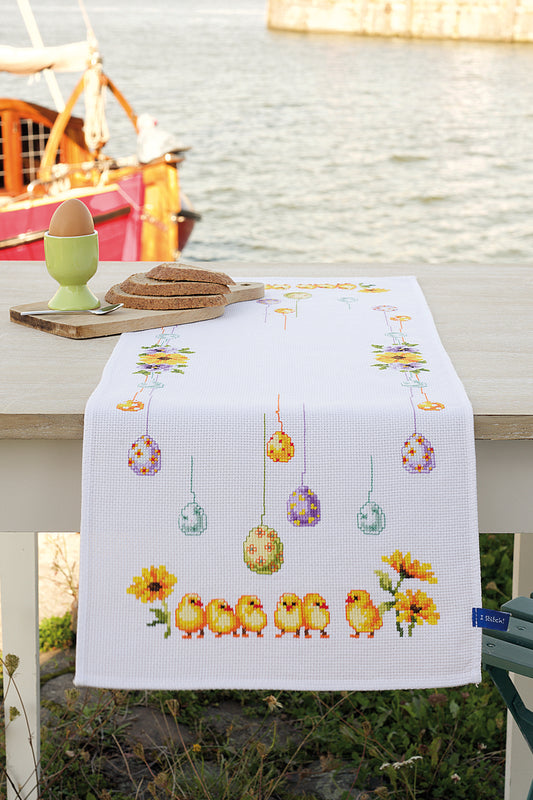 Cross stitched table runner with chicks and eggs