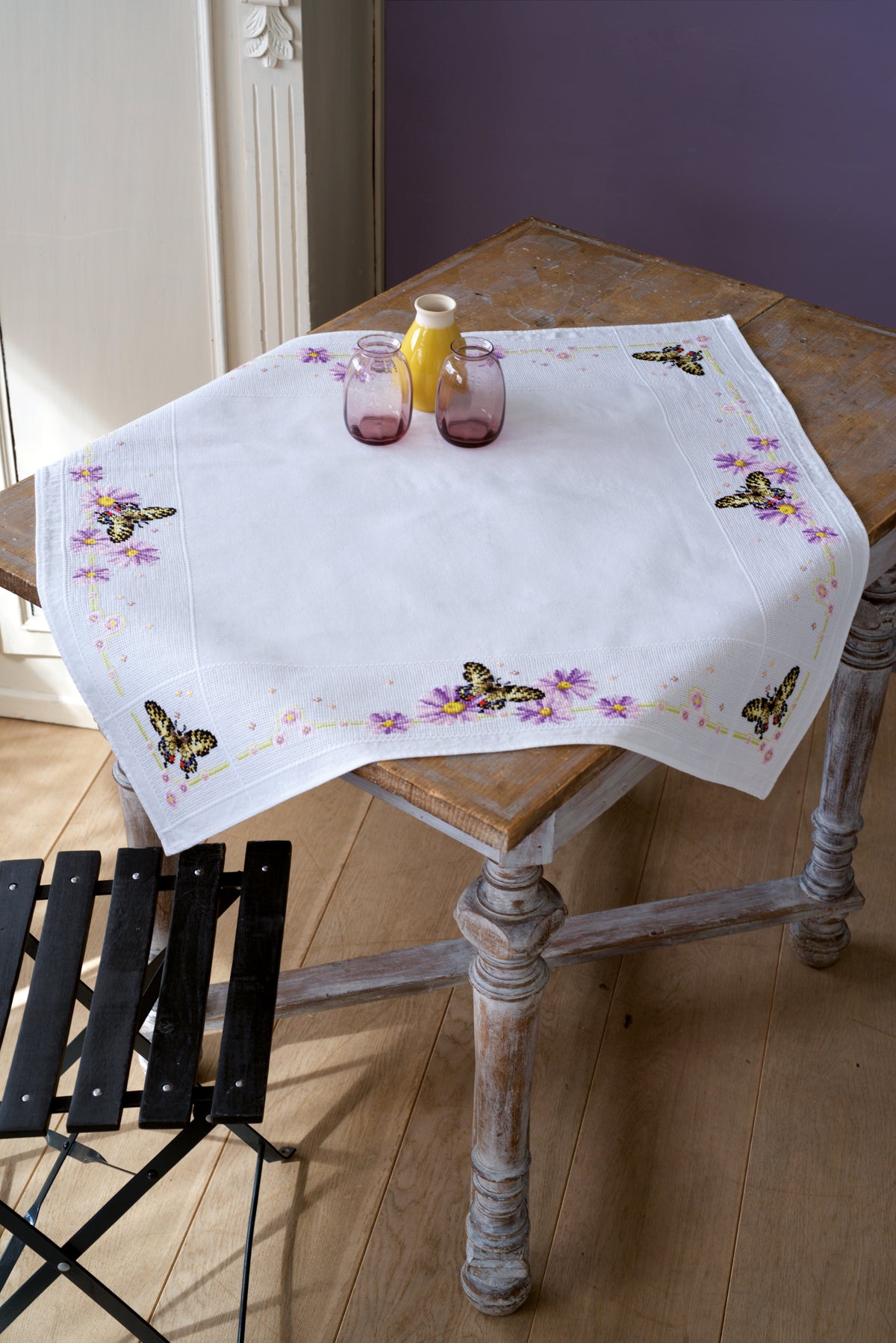 Cross stitched tablecloth with butterflies