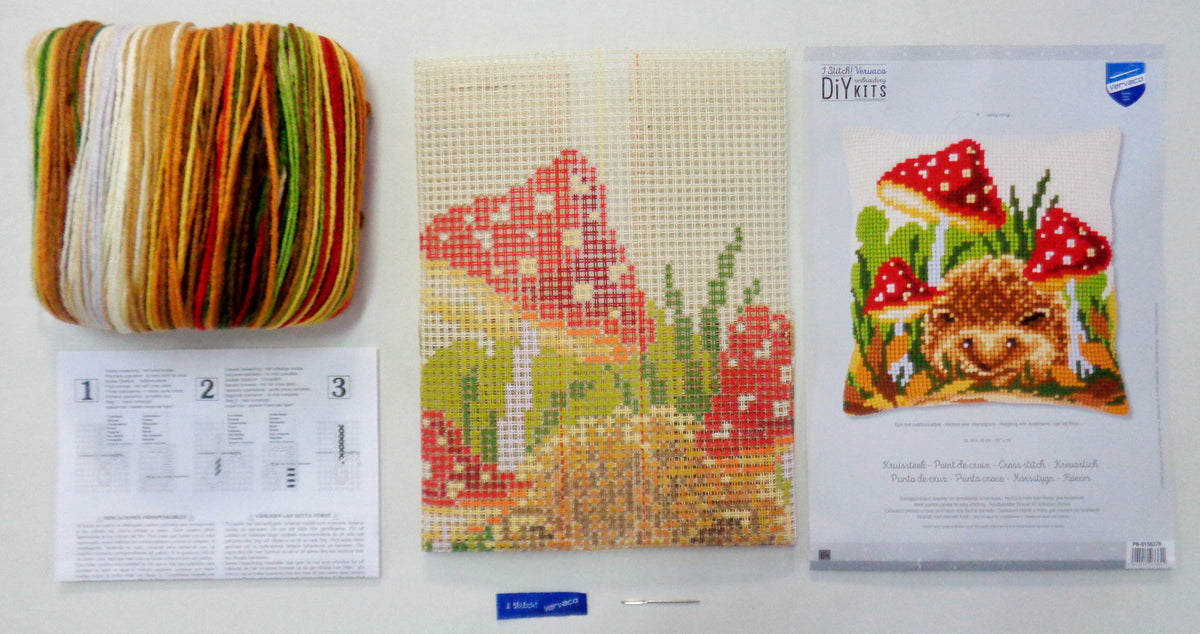 Cross stitch cushion with hedgehog and mushrooms