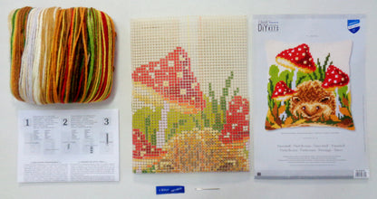 Cross stitch cushion with hedgehog and mushrooms