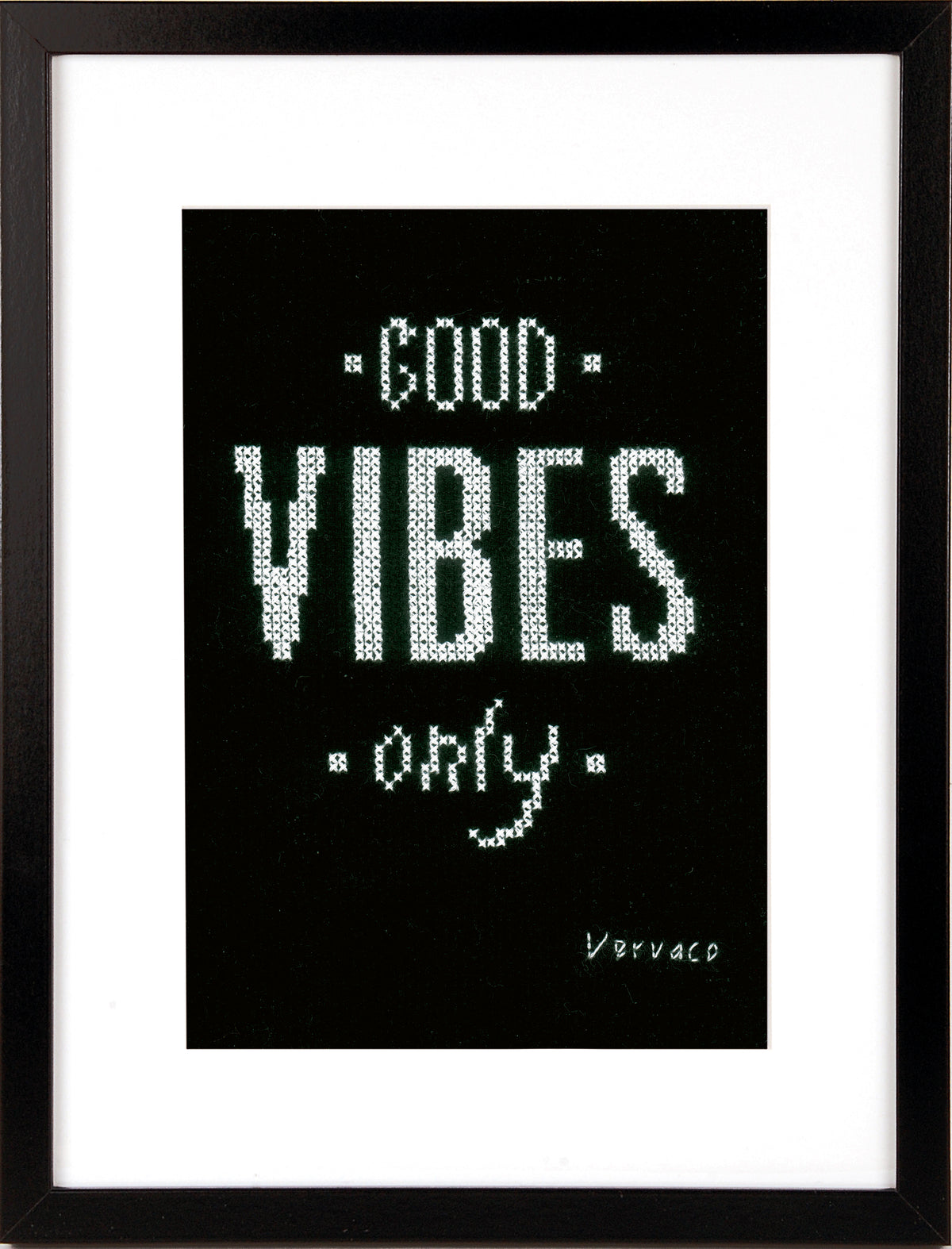 Cross stitched Good Vibes design on black fabric