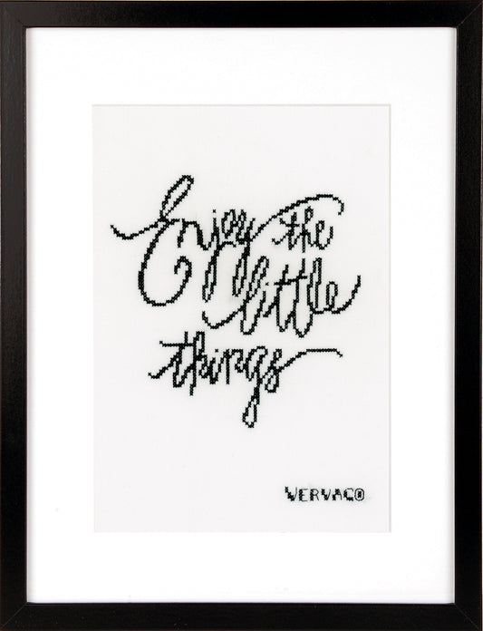 Cross stitched Enjoy the Little Things design on black fabric