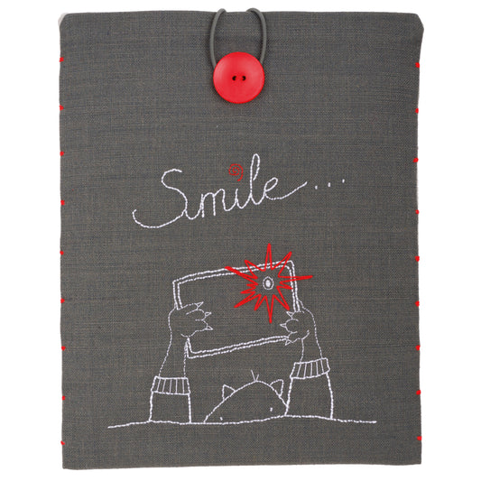 Embroidered grey tablet cover with 'Smile' design