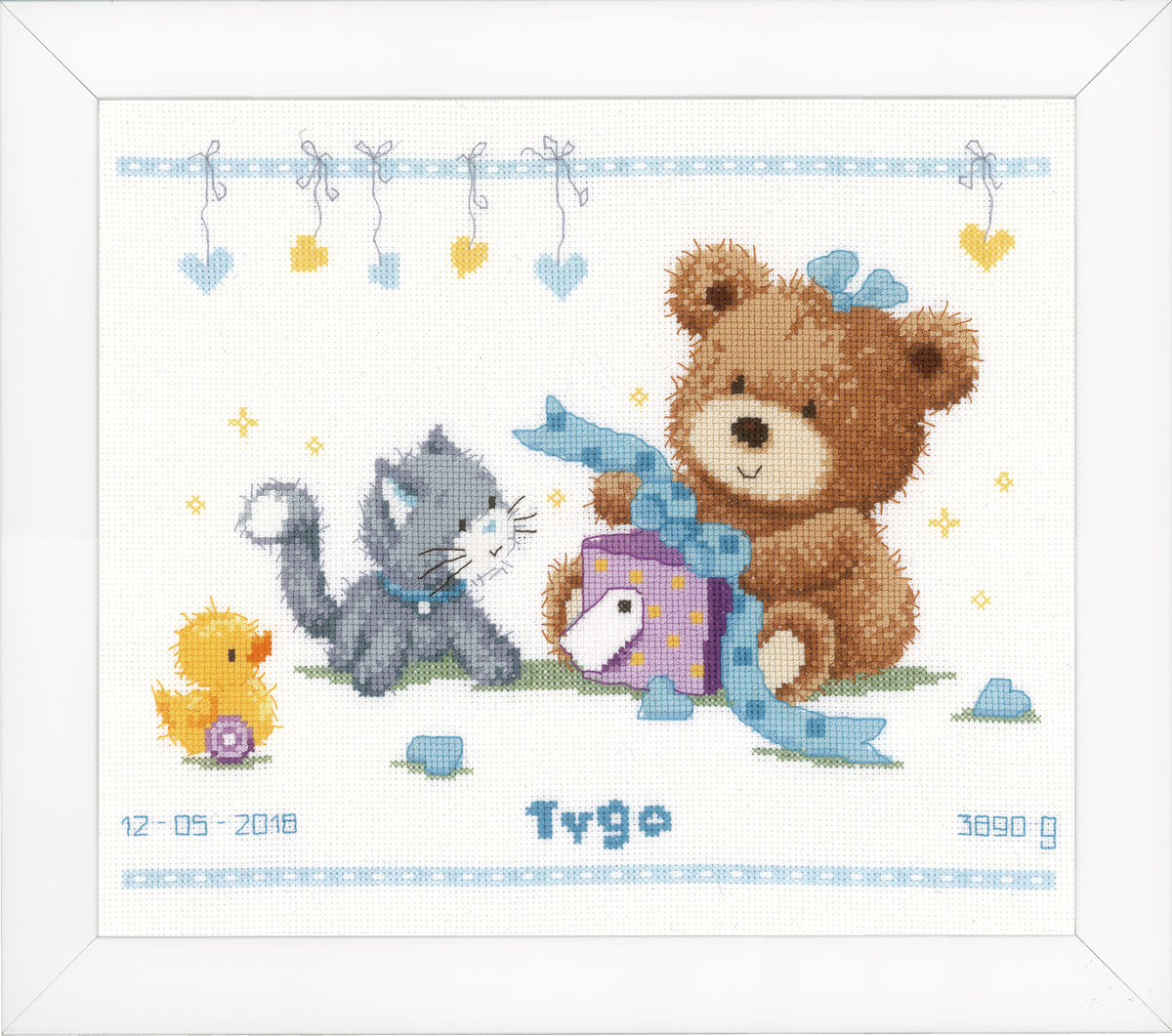 Cross stitch of a teddy bear with a present