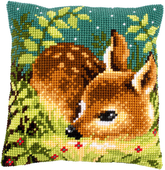 Cross stitch cushion with deer standing in grass