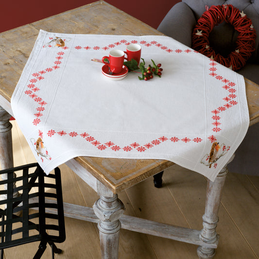 Cross stitched white tablecloth with robin design