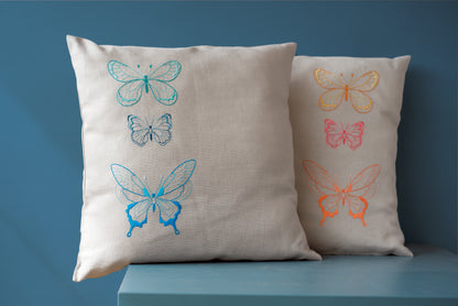 Grey cushion embroidered with blue butterflies