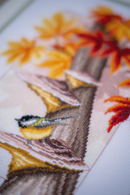 Chickadee birds among leaves cross stitch design