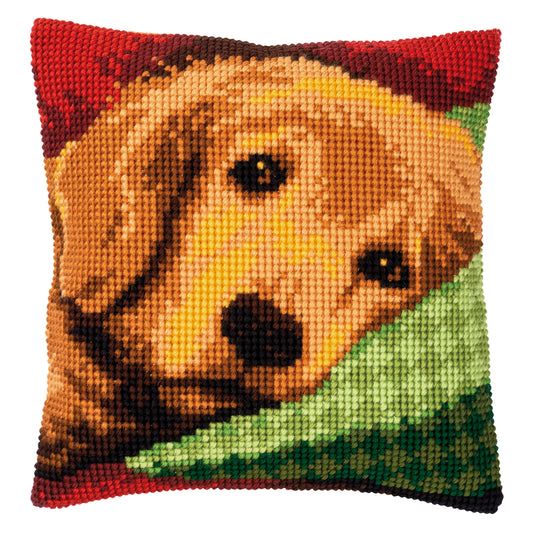 Cross stitch cushion showing a sleepy little dog design