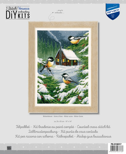 Cross stitch picture of a snowy winter scene