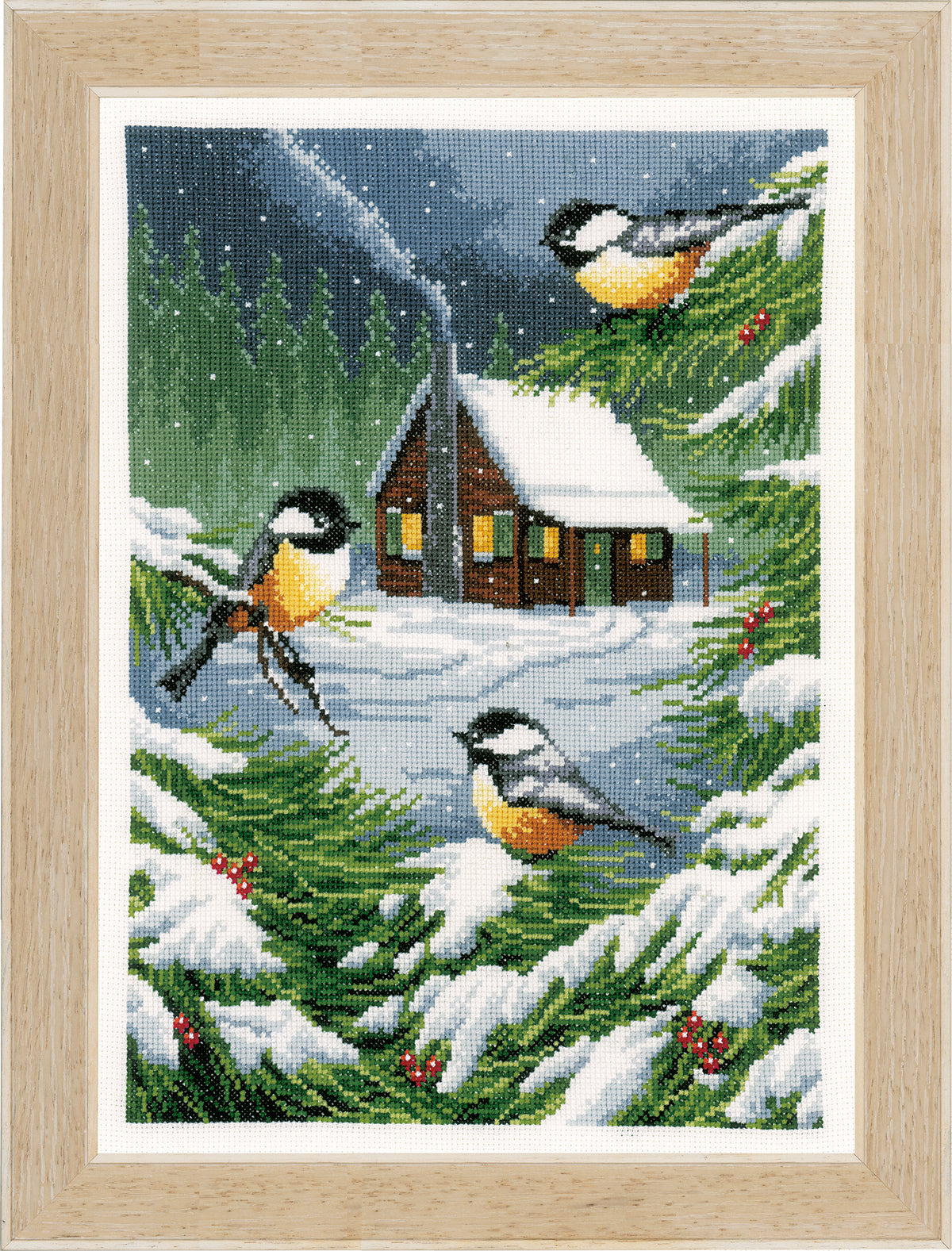 Cross stitch picture of a snowy winter scene