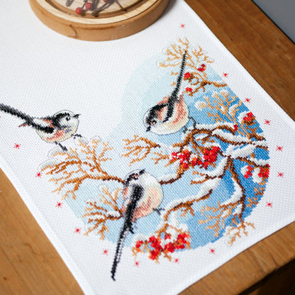 Cross stitch table runner with long-tailed tits and red berries