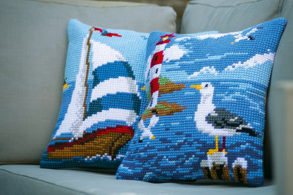 Cross stitch cushion with a lighthouse and seagulls