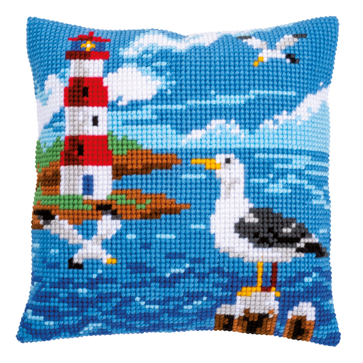Cross stitch cushion with a lighthouse and seagulls