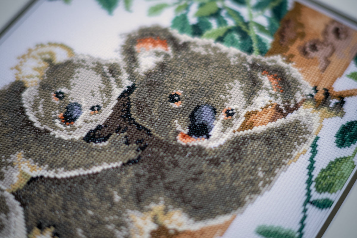Cross stitch picture of a koala and her baby