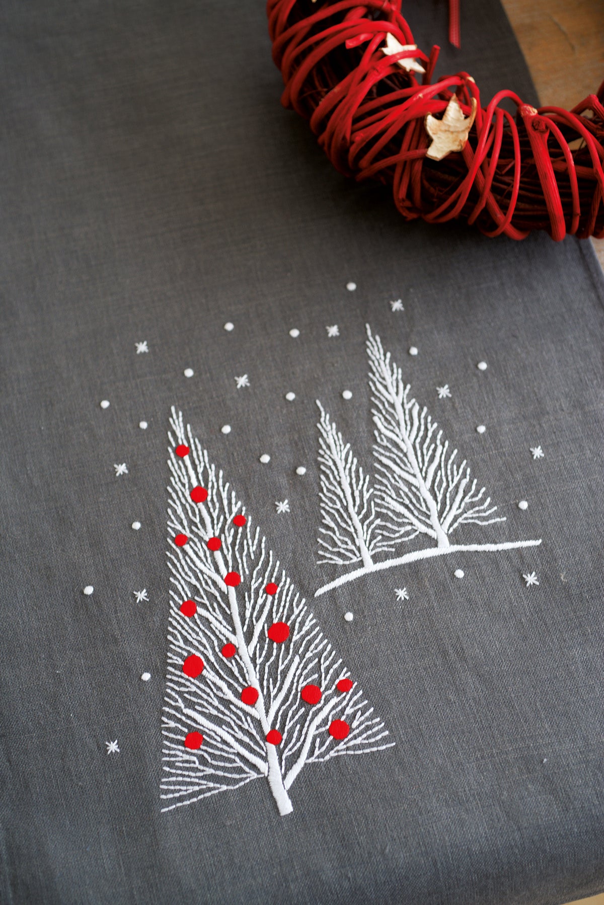 Dark grey embroidered table runner with Christmas trees