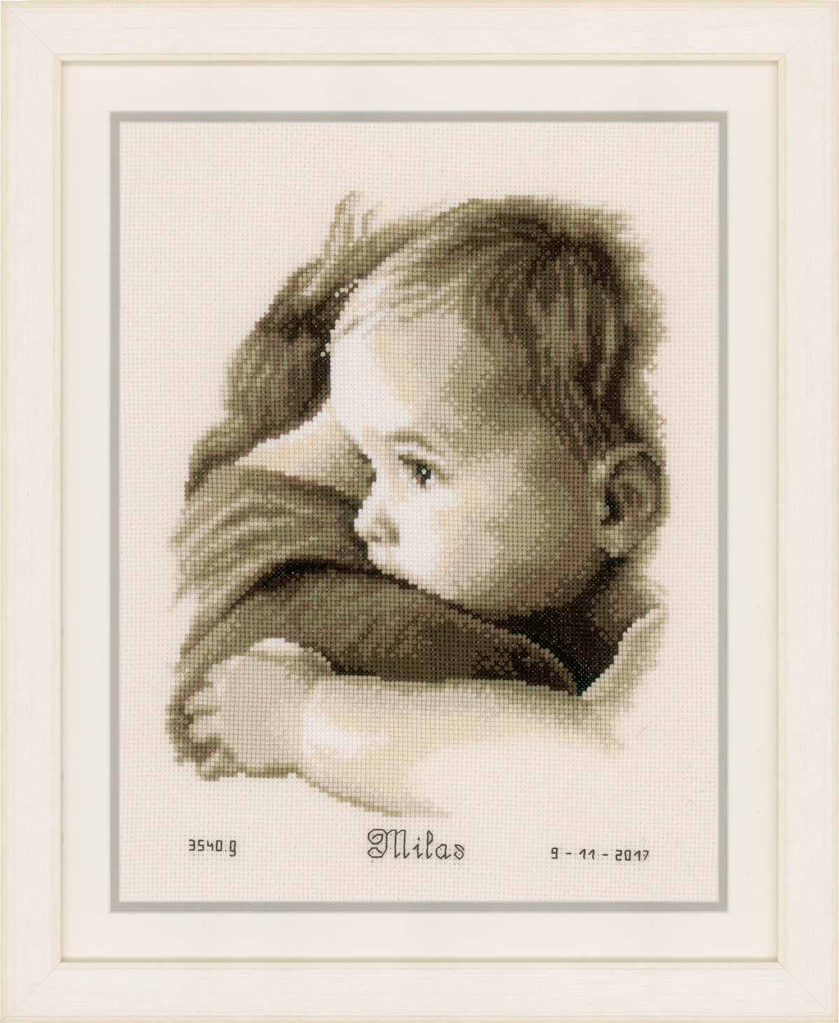 Cross stitch birth record with a baby hug design