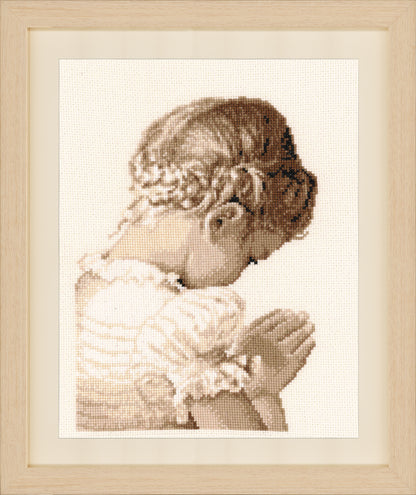 Cross stitch picture of a praying girl