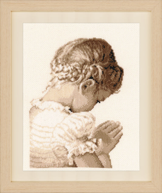 Cross stitch picture of a praying girl