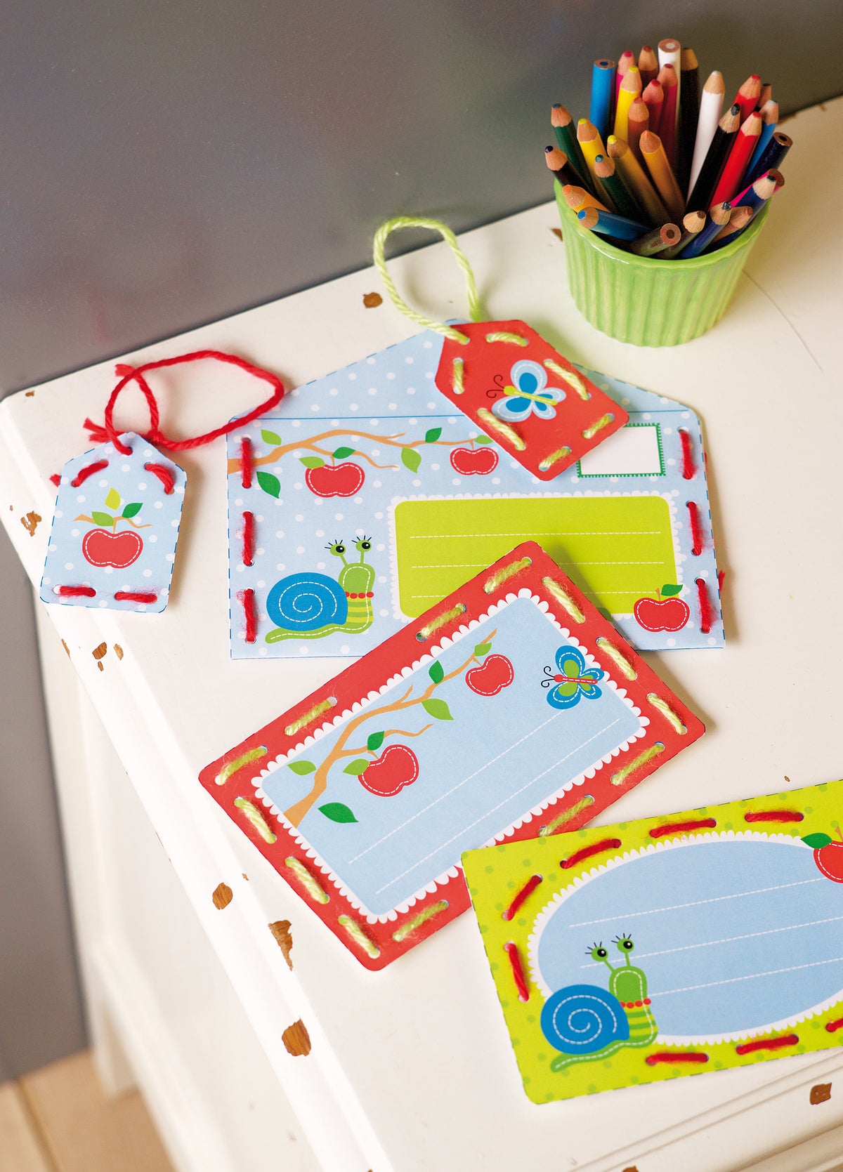 Children's stitched cards and tags with apples