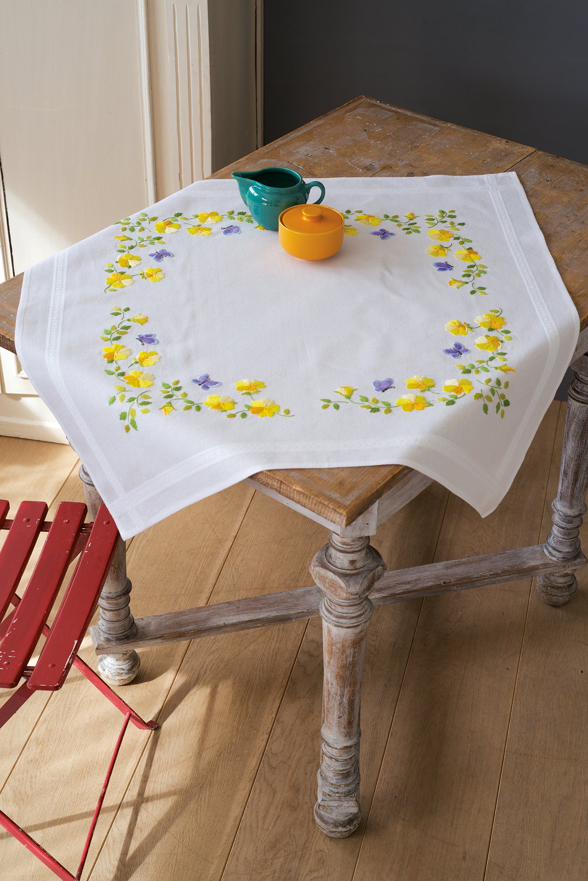Embroidered white tablecloth with spring flowers