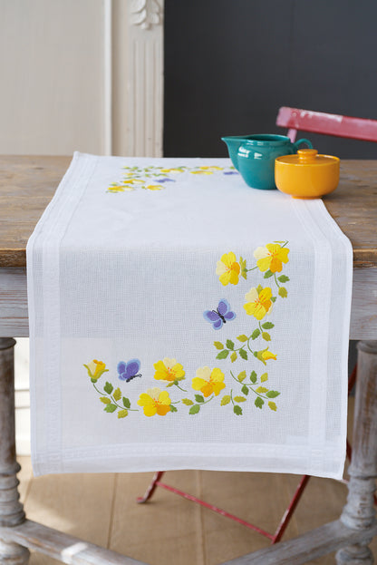 Embroidered white table runner with spring flower designs