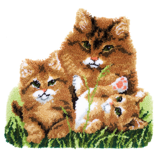 Cat-shaped latch hook rug showing a cat family