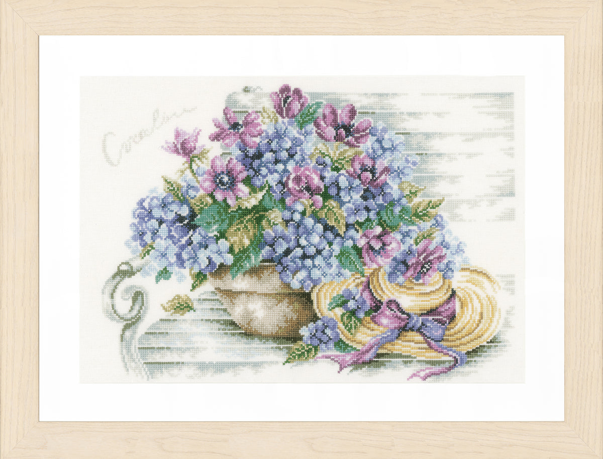 Cross stitch of hydrangeas on a garden bench
