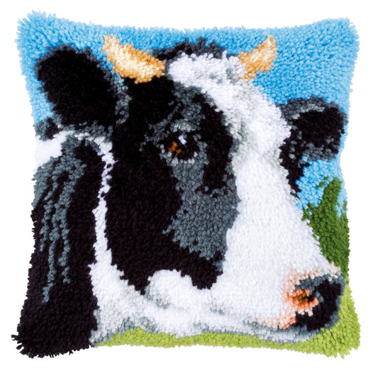 Latch hook cushion with a cow design