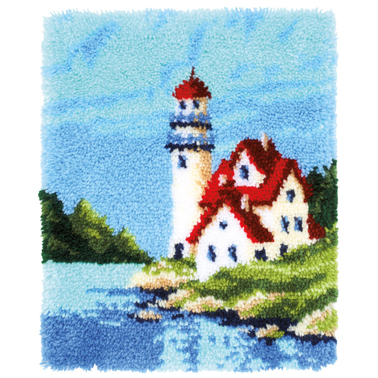 Latch hook rug with a lighthouse by the sea